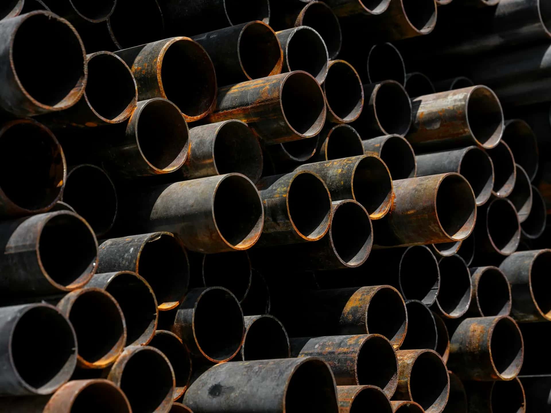 Stack of mild steel round pipes viewed from the ends