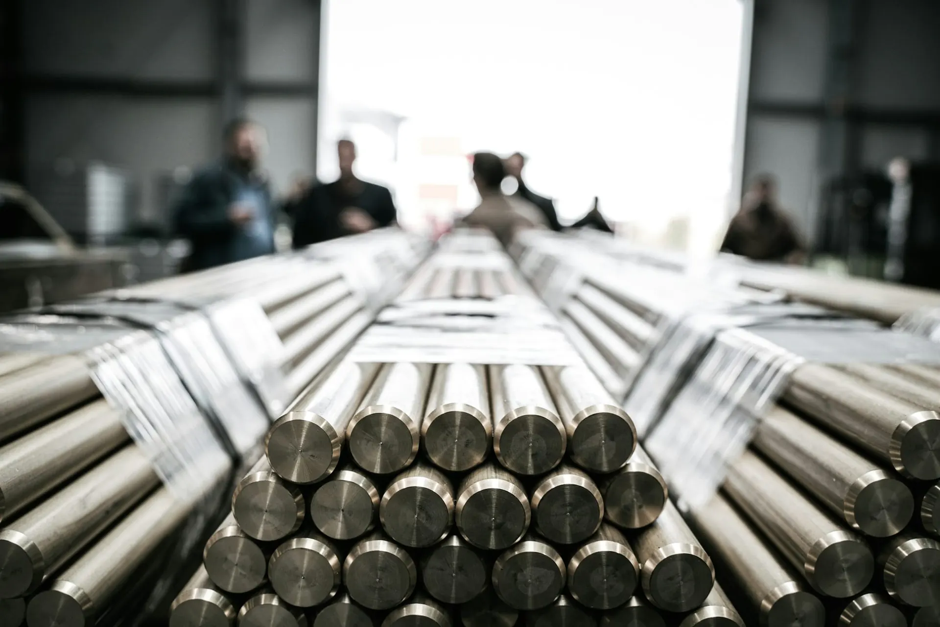 Bundles of solid steel round bars in a factory