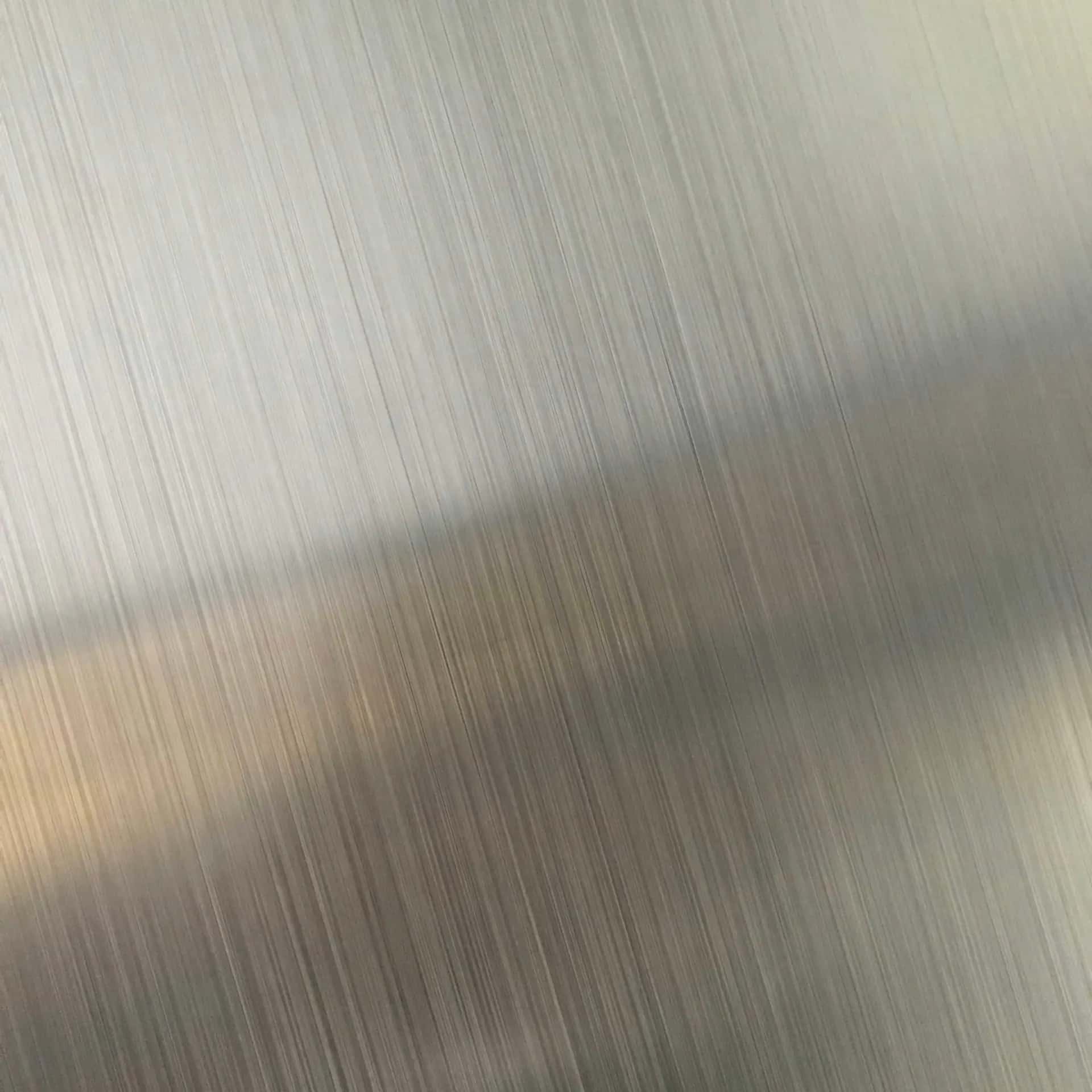 Brushed stainless steel surface with light reflection
