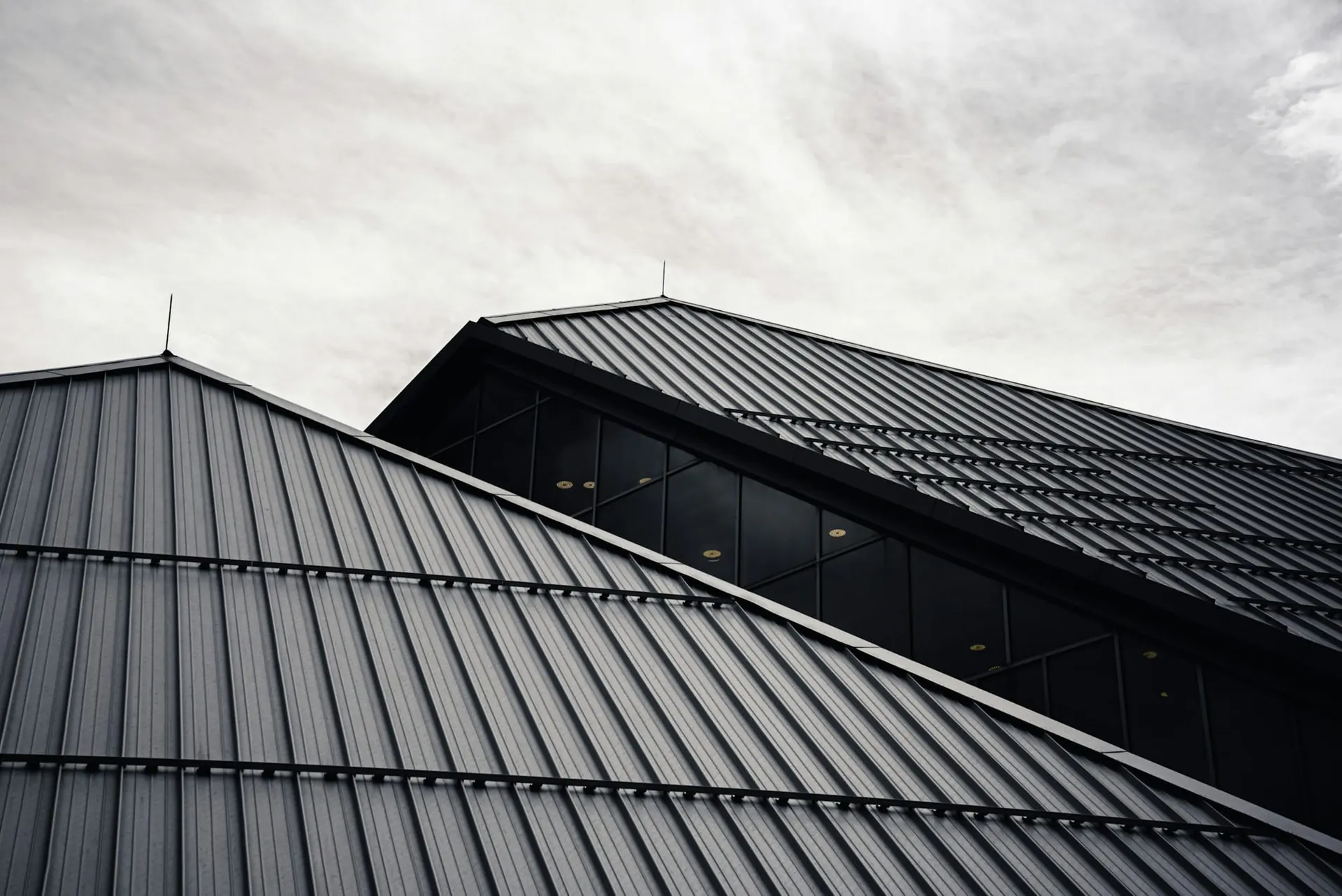 Dark profiled metal roofing on a modern building