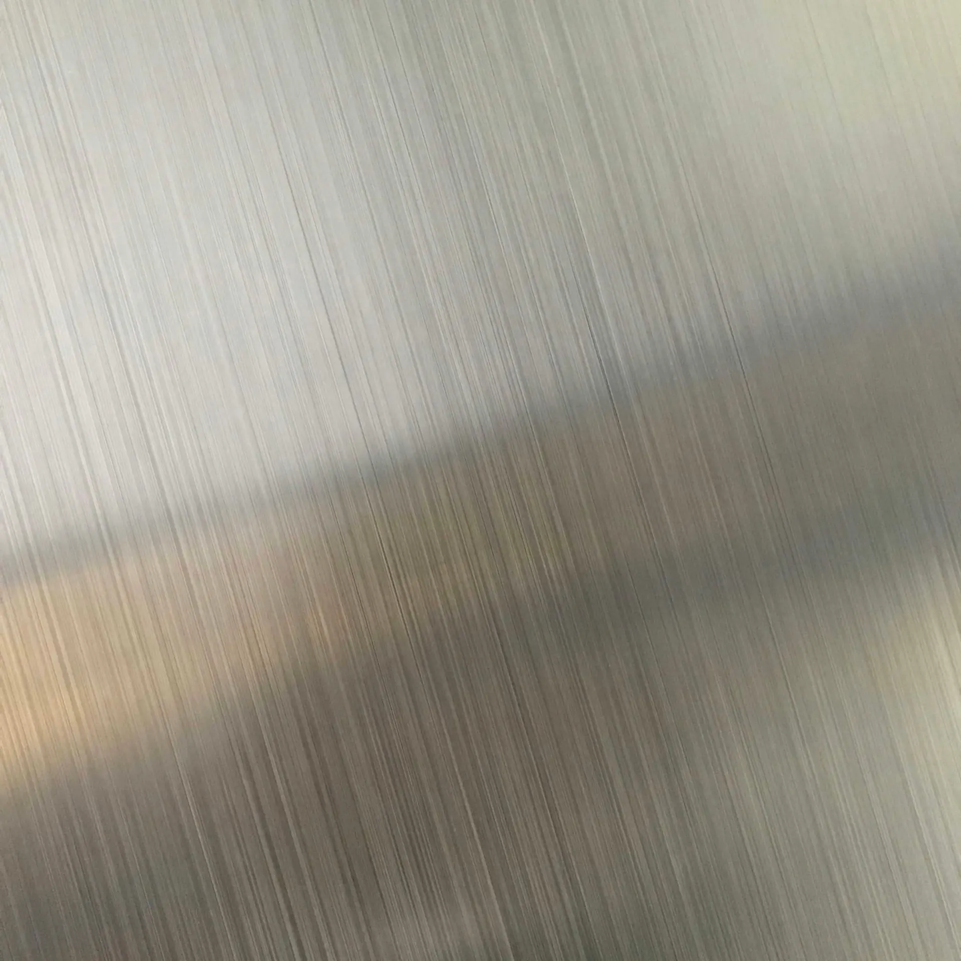 Brushed stainless steel surface with light reflection