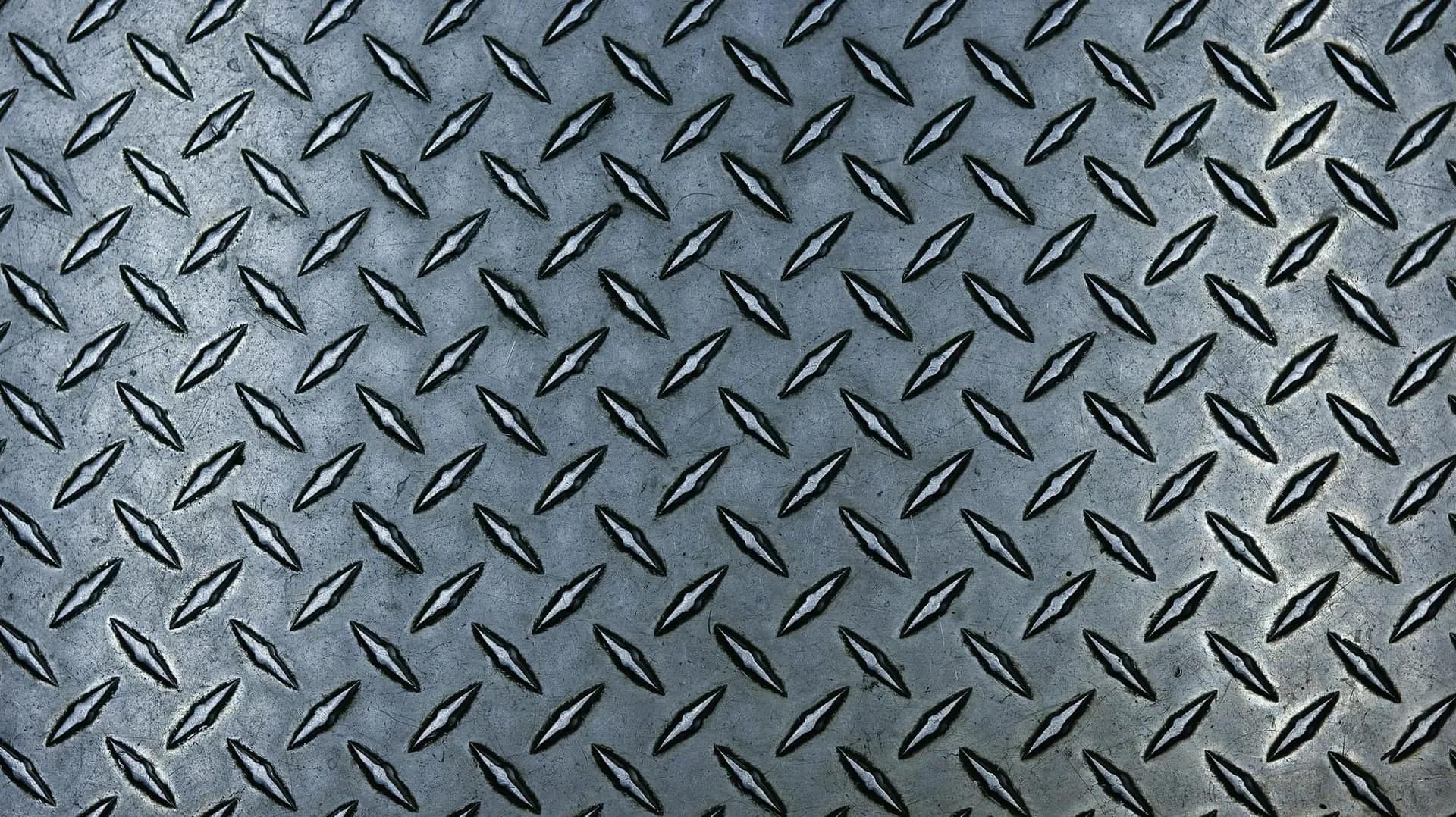 Chequered steel plate with raised pattern