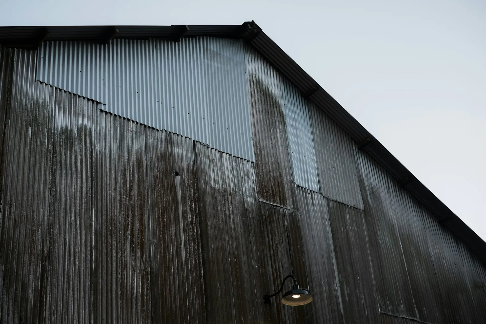 Industrial shed clad in corrugated metal sheets