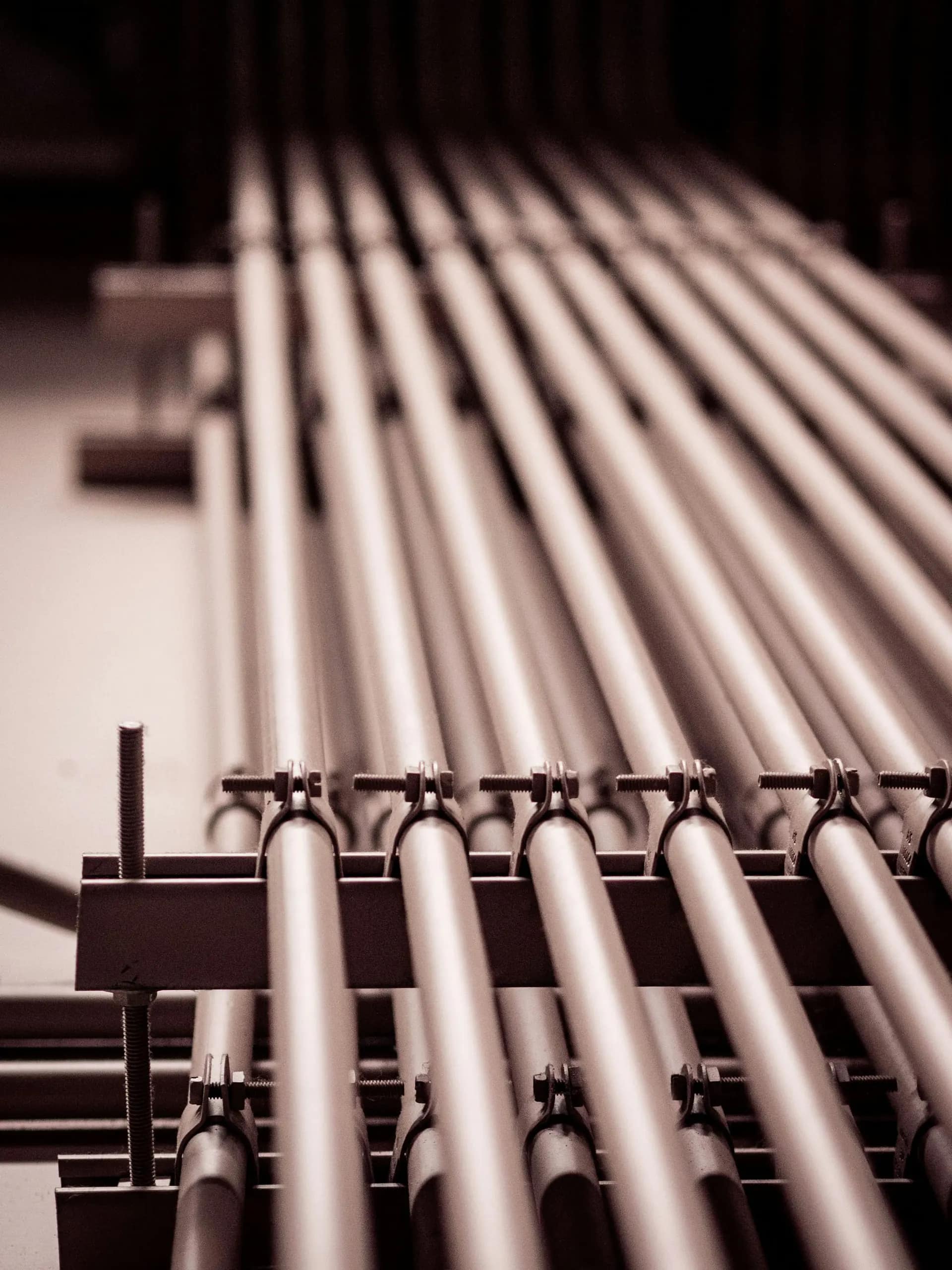 Bundle of black steel pipes stacked end-on