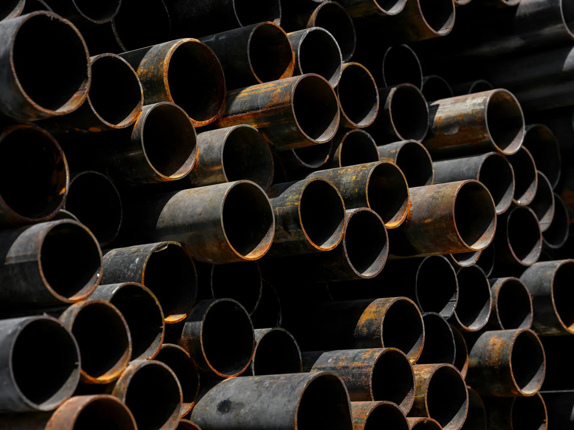 Stack of mild steel round pipes viewed from the ends