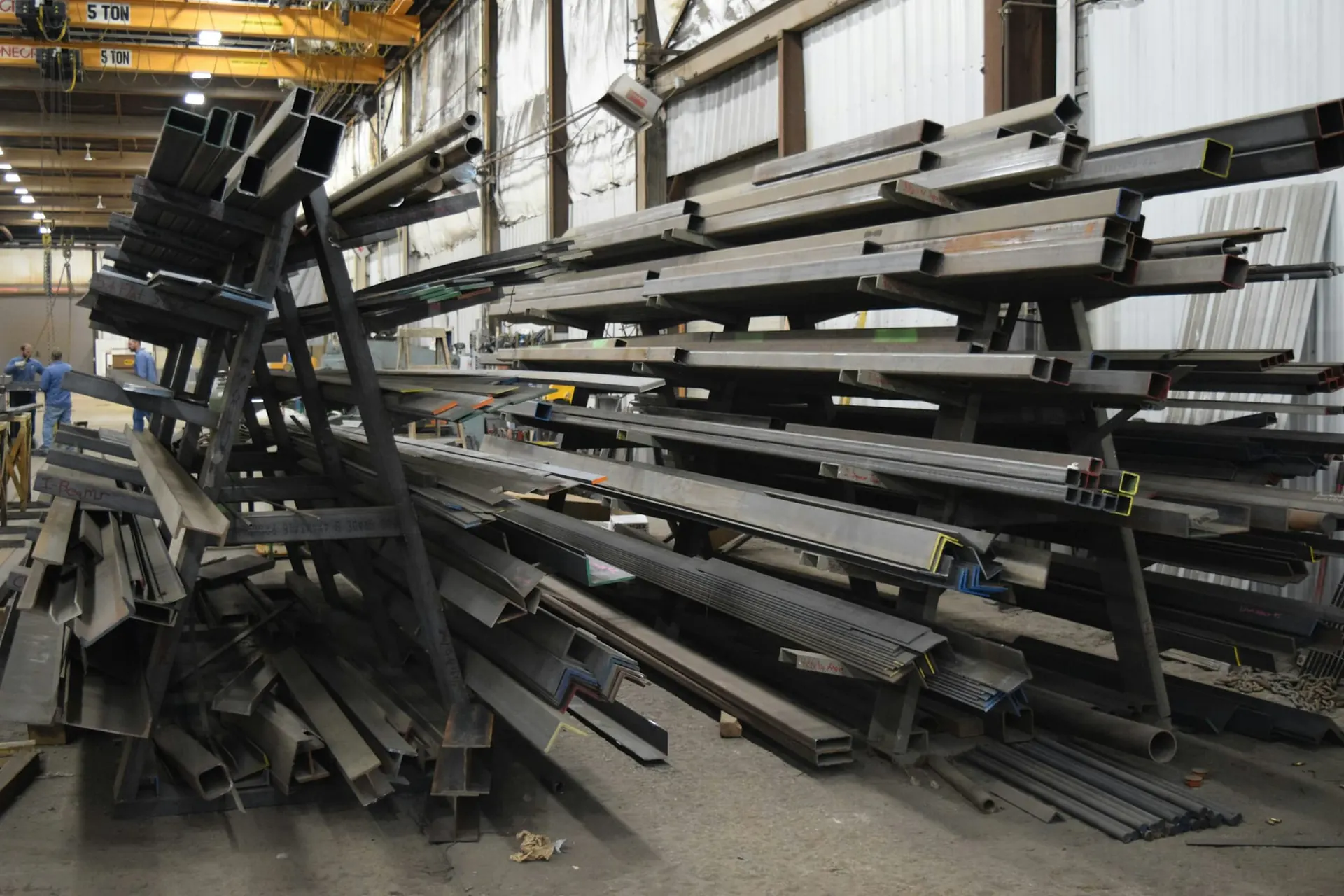 Structural steel sections, channels and tubes stacked in a warehouse